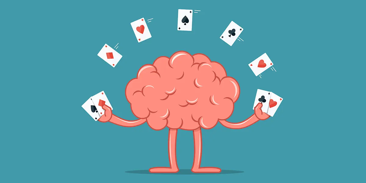 Illustration eines Gehirns, das mit Spielkarten jongliert