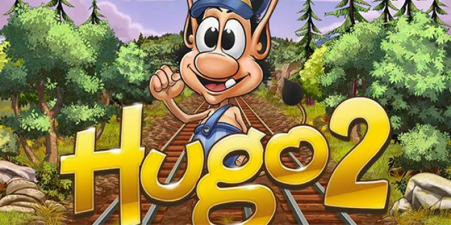 Die Hauptfigur Hugo hinter dem Hugo 2 Schriftzug am Gleis. 